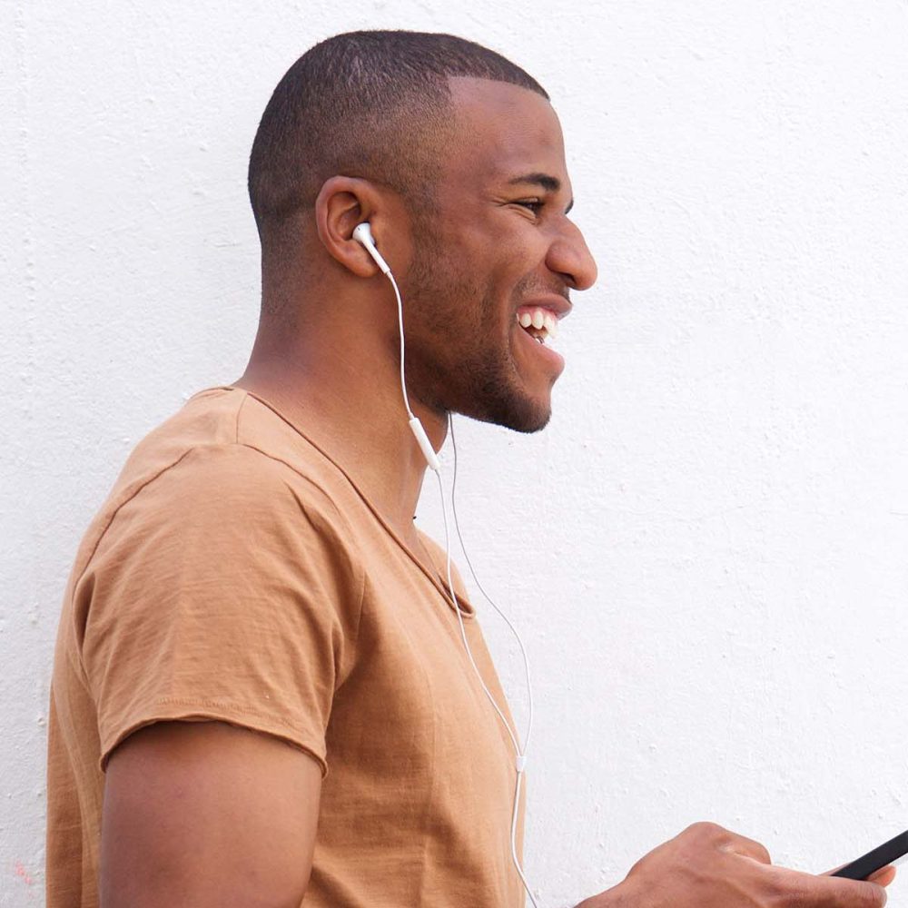 portrait-of-afro-american-man-listening-music-agai-CAJQK28.jpg